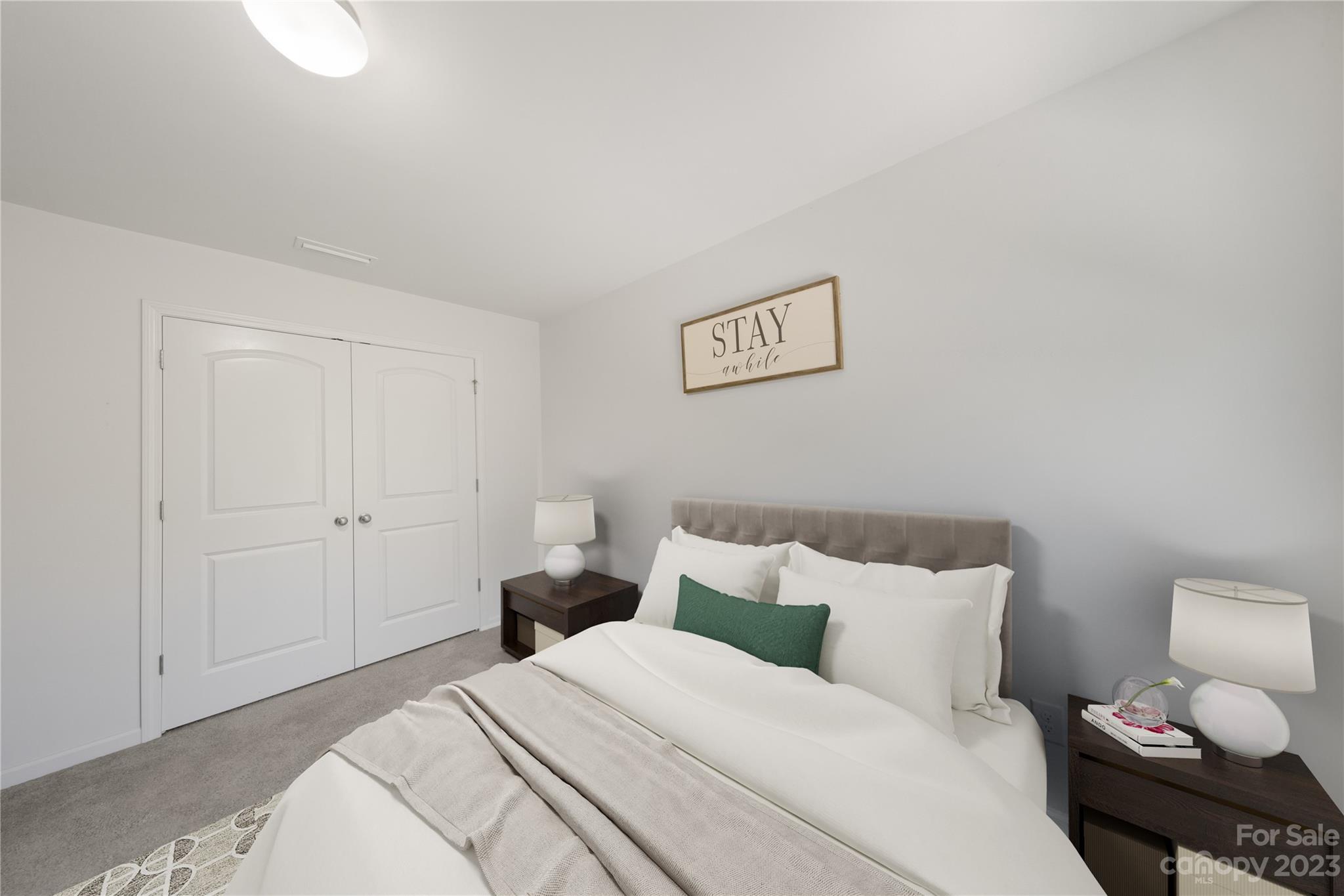 360 Wyndham Forest Circle Midland, NC 28107 - Photo 27 of 40 a bedroom with a bed and a lamp on dresser