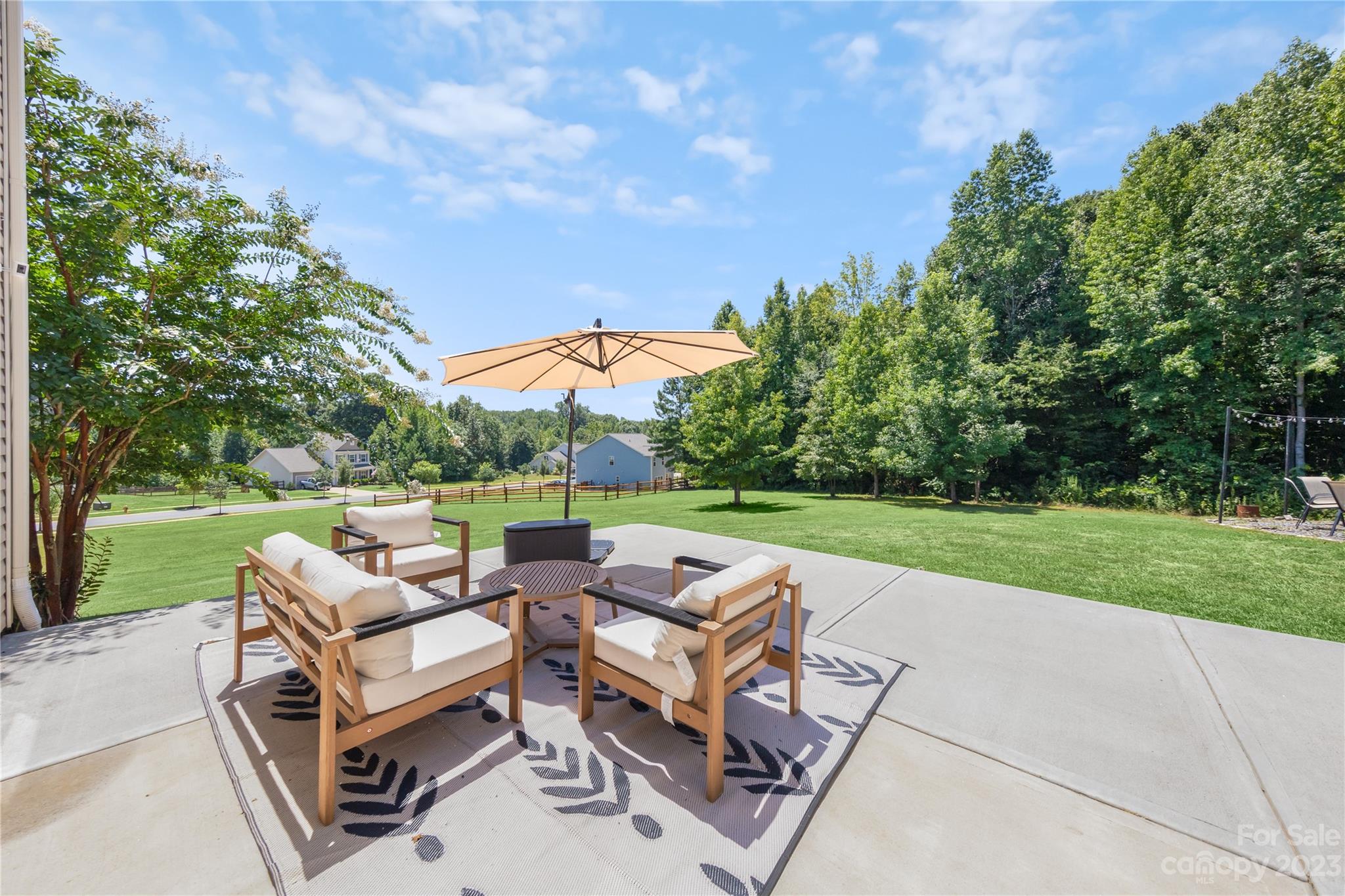360 Wyndham Forest Circle Midland, NC 28107 - Photo 31 of 40 a view of a patio with couches chairs and a yard