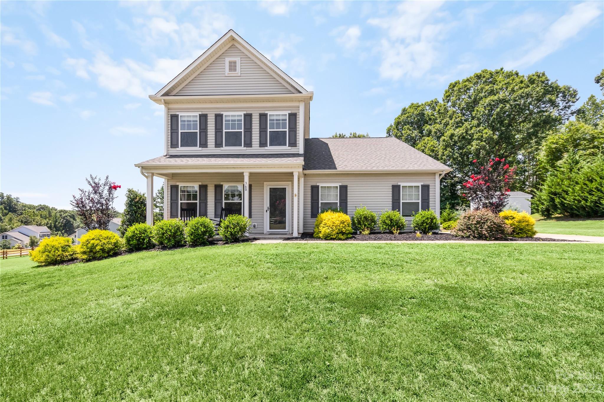 360 Wyndham Forest Circle Midland, NC 28107 - Photo 36 of 40 a front view of a house with a yard and garage