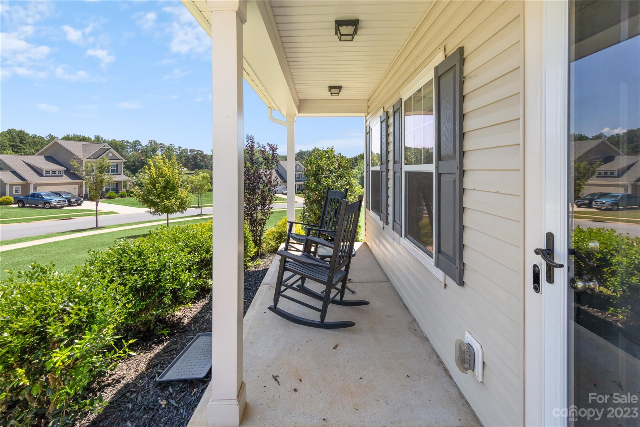360 Wyndham Forest Circle Midland, NC 28107 - Photo 4 of 40 a view of chair and table in the balcony