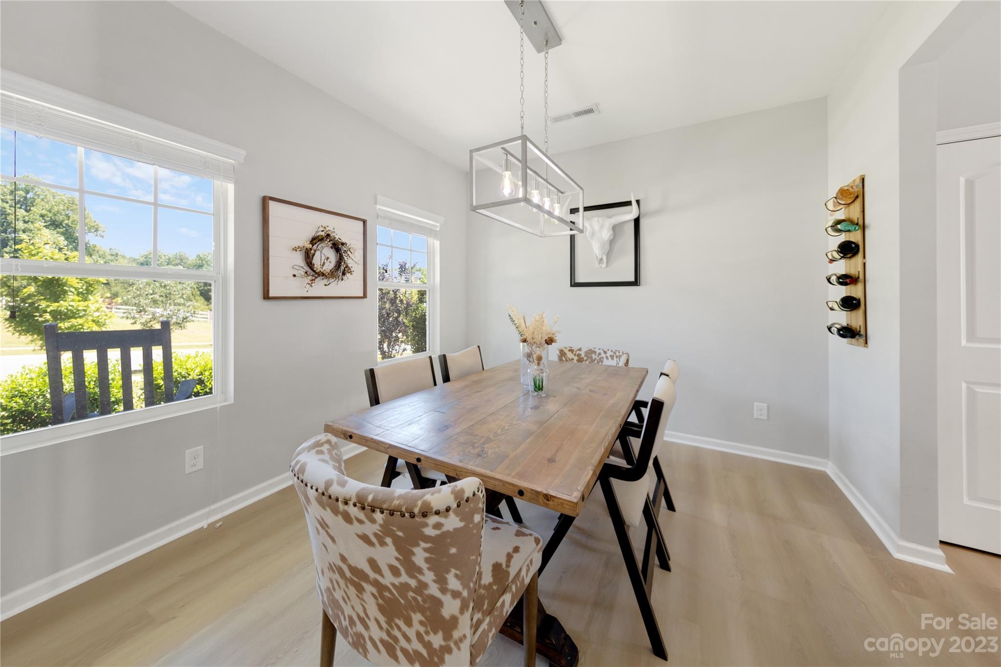 360 Wyndham Forest Circle Midland, NC 28107 - Photo 6 of 40 a view of a dining room with furniture and window