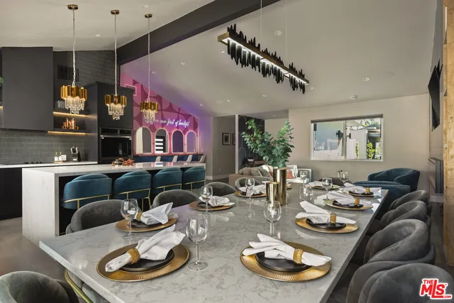 a kitchen with stainless steel appliances granite countertop a sink refrigerator and microwave