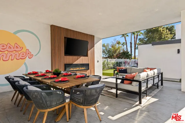 a view of a swimming pool with a patio