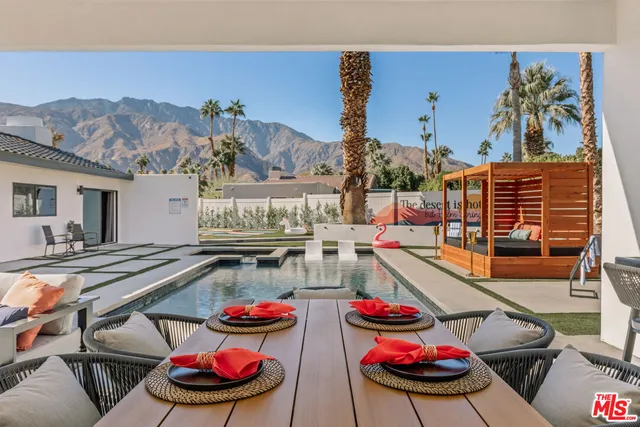 a kitchen with a table and chairs