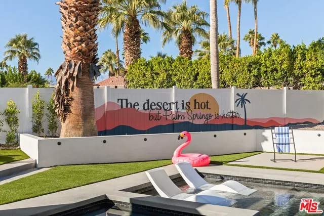 a view of swimming pool from a balcony