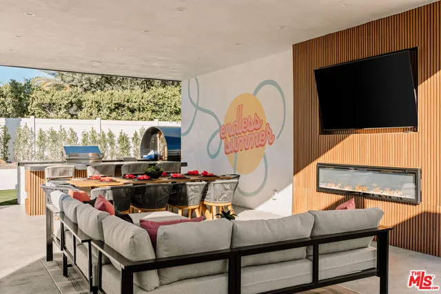 a room with furniture and a flat screen tv