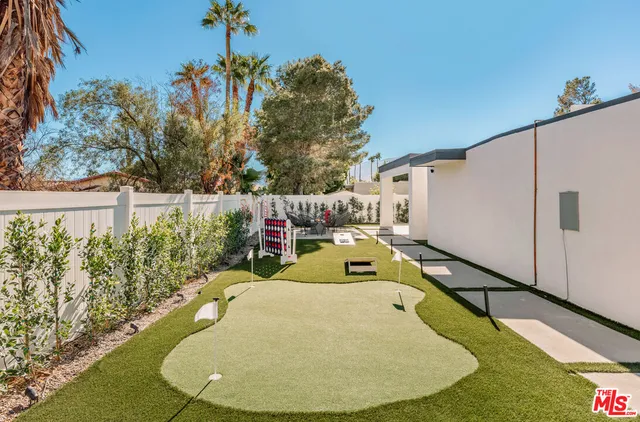 a view of a patio with swimming pool