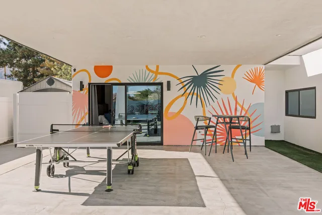 a view of swimming pool with seating space