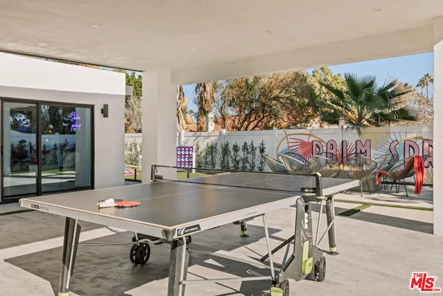 an aerial view of residential house and sandy dunes