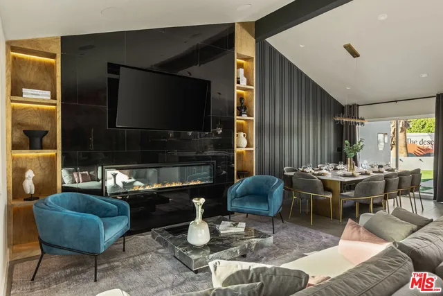 a dining room with furniture and wooden floor