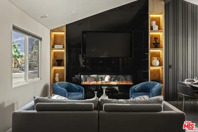 a dining room with furniture and a window