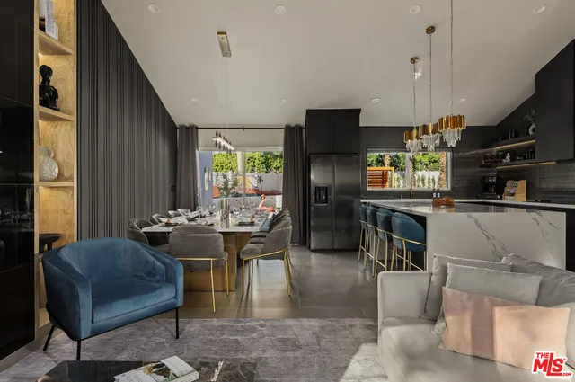 a view of a dining room with furniture and chandelier