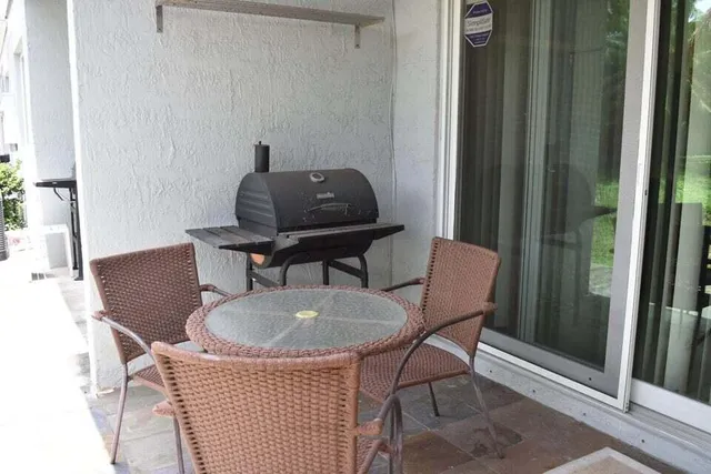 a view of a chair and table in a livingroom