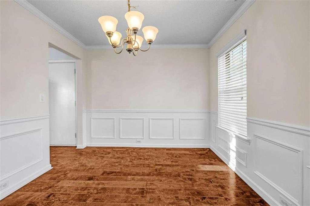 1903 Cobblestone Court Conyers, GA 30012 - Photo 11 of 30 a view of empty room with wooden floor