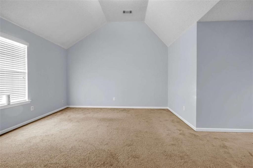 1903 Cobblestone Court Conyers, GA 30012 - Photo 19 of 30 an empty room with a window