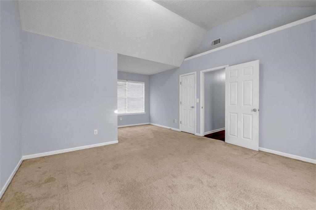 1903 Cobblestone Court Conyers, GA 30012 - Photo 20 of 30 a view of an empty room with a window
