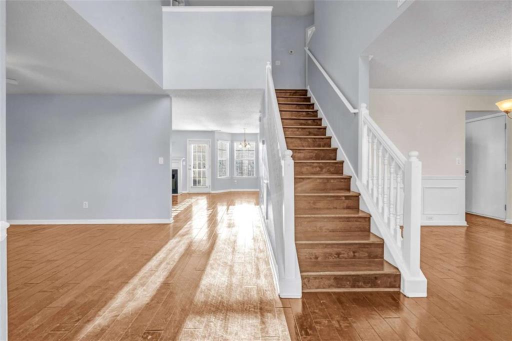 1903 Cobblestone Court Conyers, GA 30012 - Photo 2 of 30 a view of entryway and hall with wooden floor