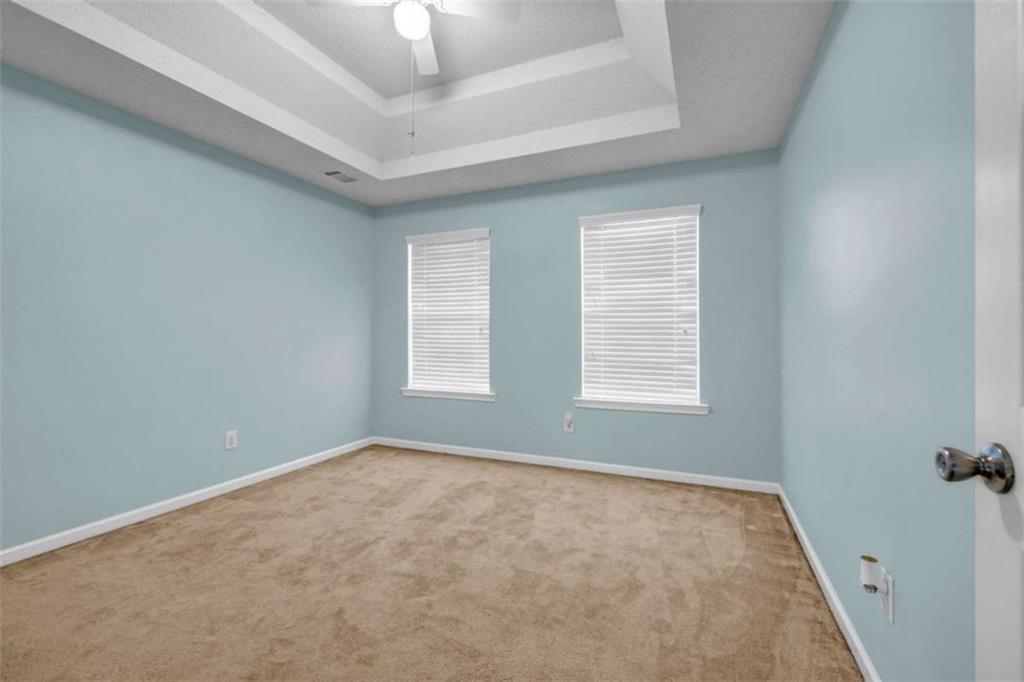 1903 Cobblestone Court Conyers, GA 30012 - Photo 22 of 30 an empty room with windows