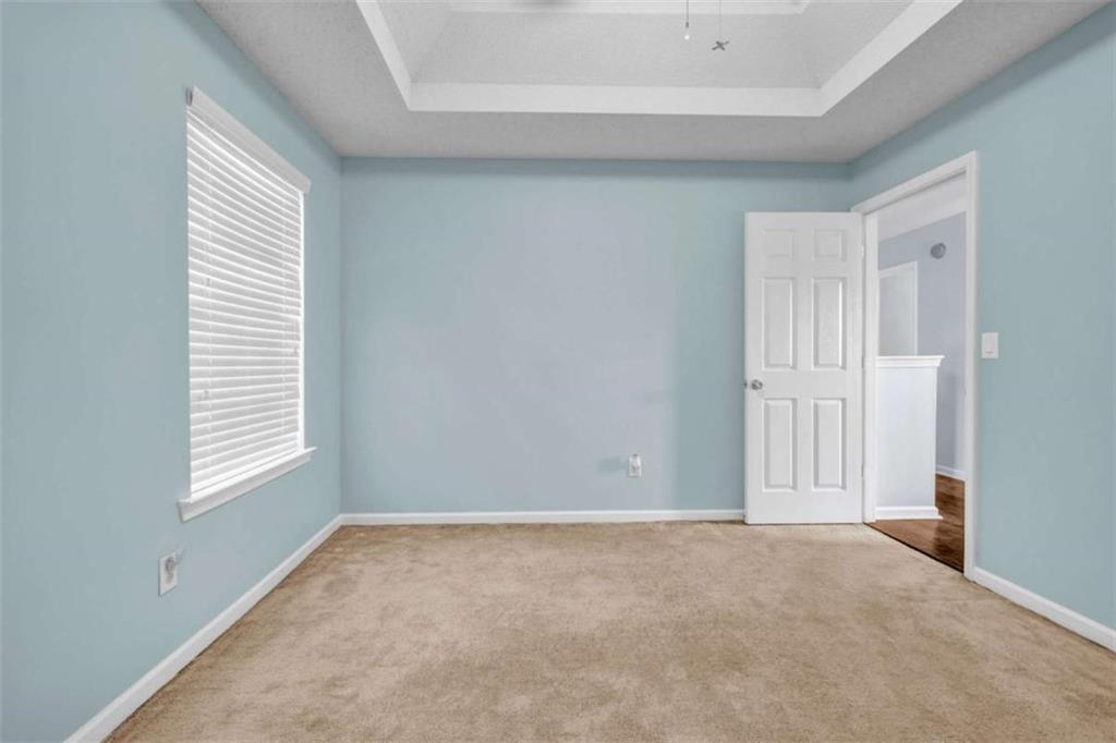 1903 Cobblestone Court Conyers, GA 30012 - Photo 23 of 30 a view of an empty room with a window