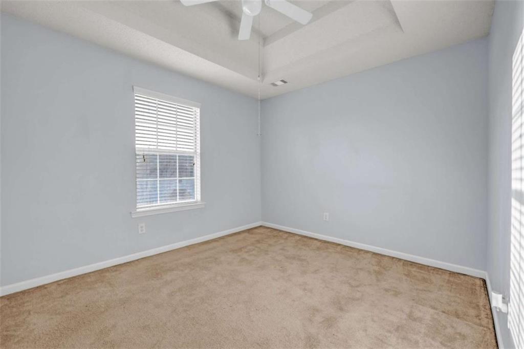 1903 Cobblestone Court Conyers, GA 30012 - Photo 24 of 30 an empty room with a window