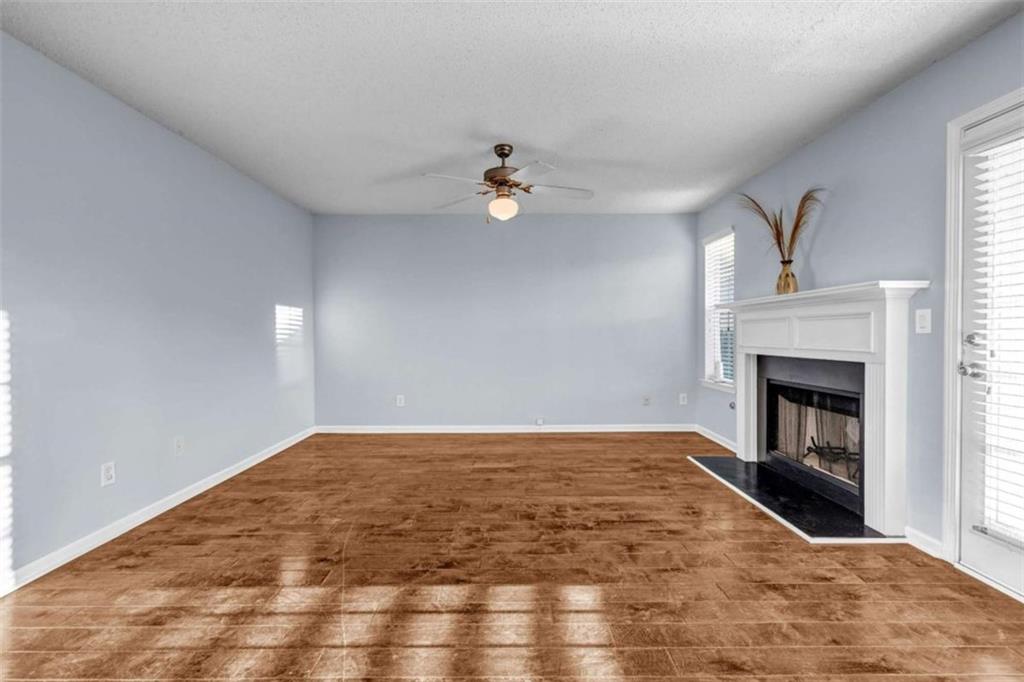 1903 Cobblestone Court Conyers, GA 30012 - Photo 8 of 30 a view of empty room with fireplace
