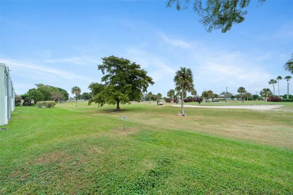 a view of a golf course with a lake