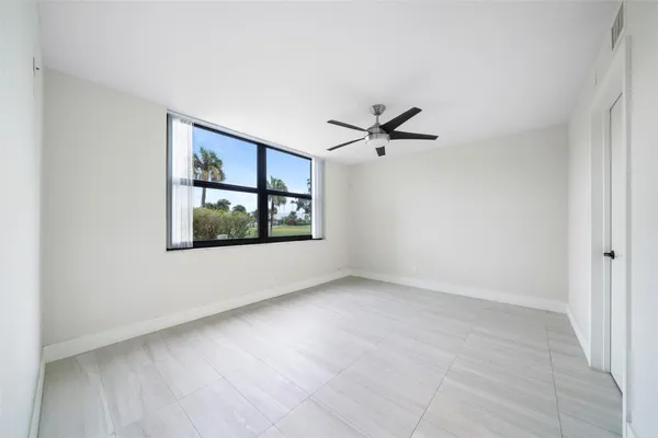 a view of an empty room with a window