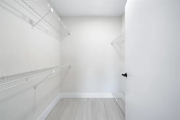 a view of a room with racks on the wall