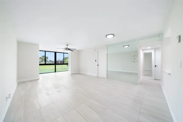 a view of an empty room with a sliding door