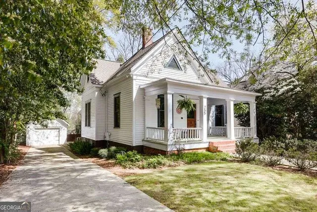a front view of a house with garden