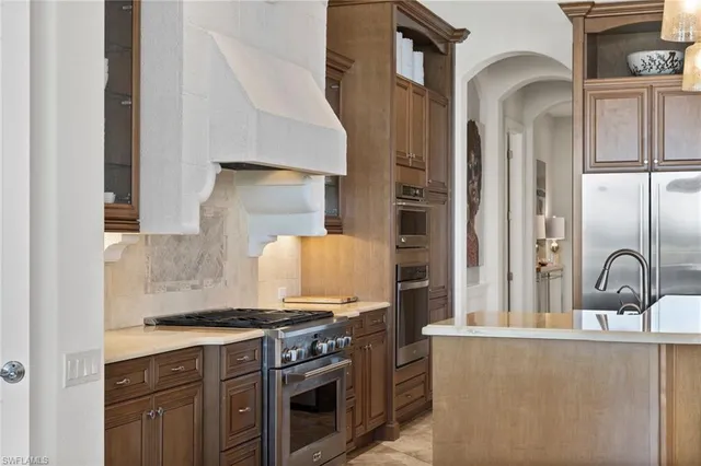 a kitchen with a stove and a sink