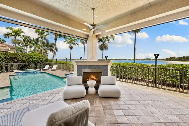 a view of a swimming pool with an outdoor seating