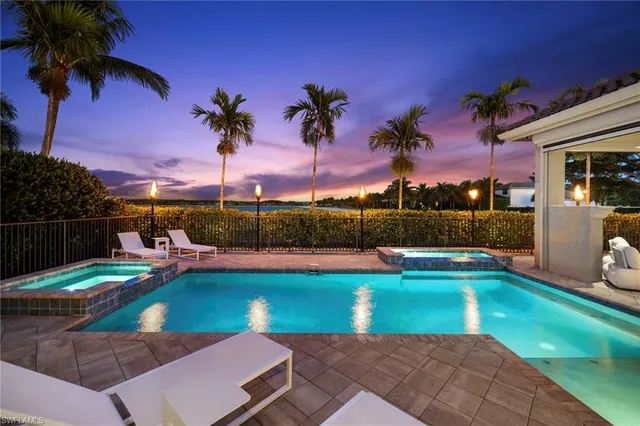 a view of a swimming pool with a patio