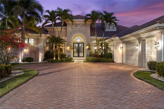 a view of residential houses with outdoor space and street view
