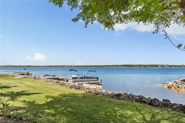 an aerial view of a house with a lake view