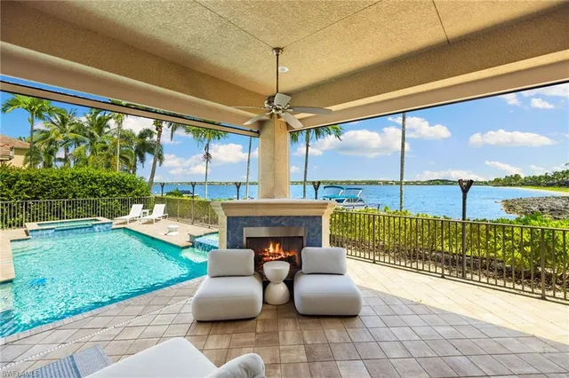 a patio with yard glass top table and chairs