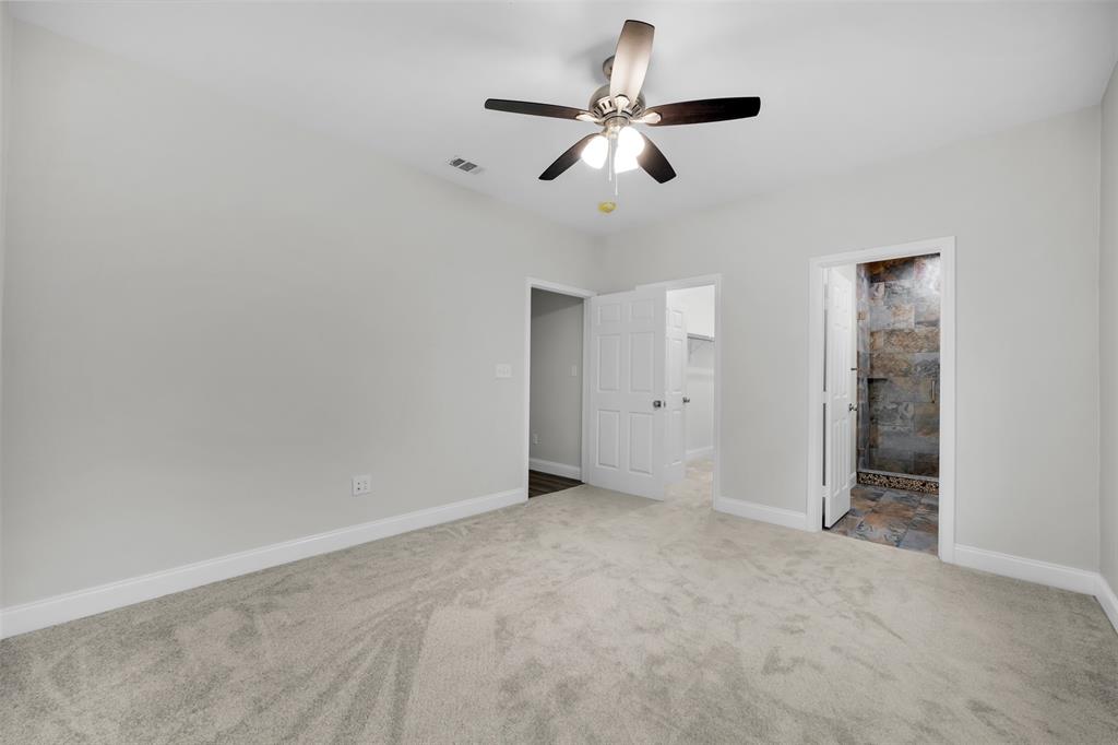 407 Dallas Street Rice, TX 75155 - Photo 14 of 25 an empty room with ceiling fan and window