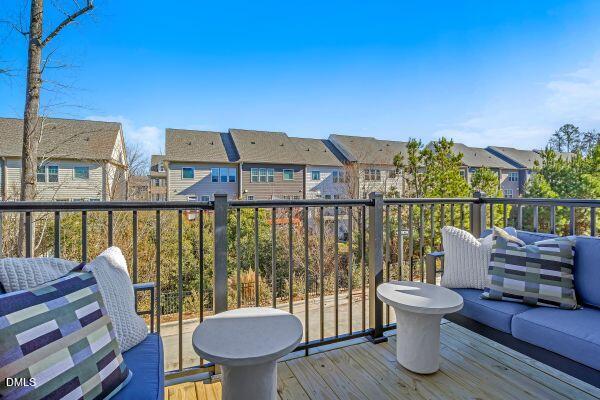605 Hedrick Ridge Road, Unit 105 Cary, NC 27519 - Photo 14 of 34 a view of a balcony with chairs
