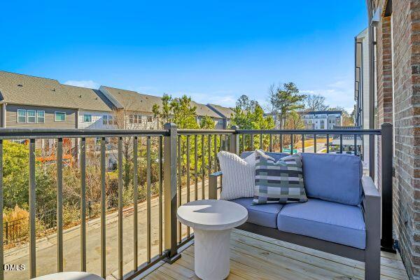605 Hedrick Ridge Road, Unit 105 Cary, NC 27519 - Photo 15 of 34 a roof deck with a table and chairs