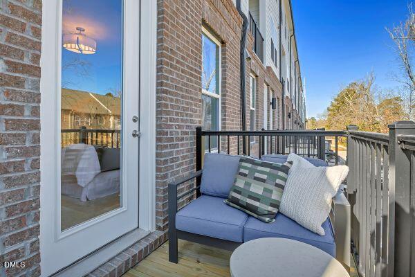 605 Hedrick Ridge Road, Unit 105 Cary, NC 27519 - Photo 16 of 34 a view of balcony with couch