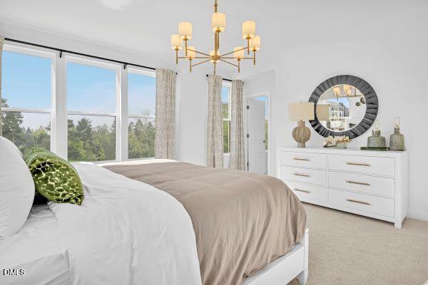 605 Hedrick Ridge Road, Unit 105 Cary, NC 27519 - Photo 27 of 34 a bedroom with a bed mirror and a window