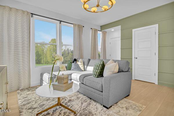 605 Hedrick Ridge Road, Unit 105 Cary, NC 27519 - Photo 10 of 34 a living room with furniture and a large window