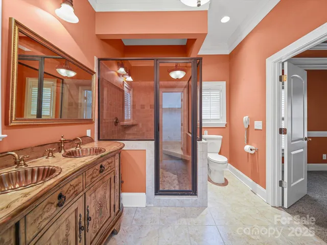 a bathroom with a sink a large mirror and a shower