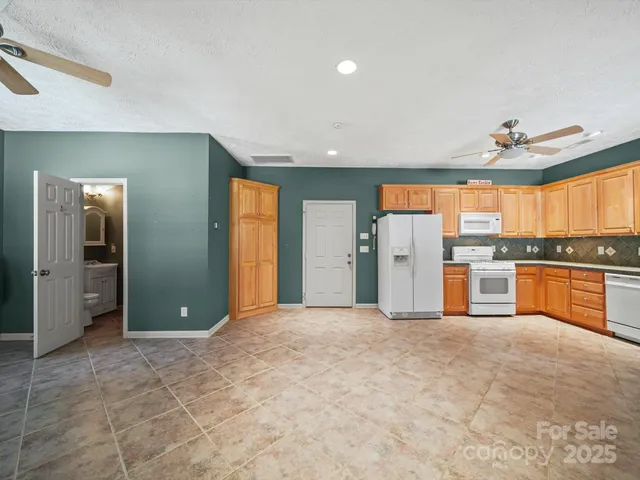 a view of a kitchen with a sink and a window