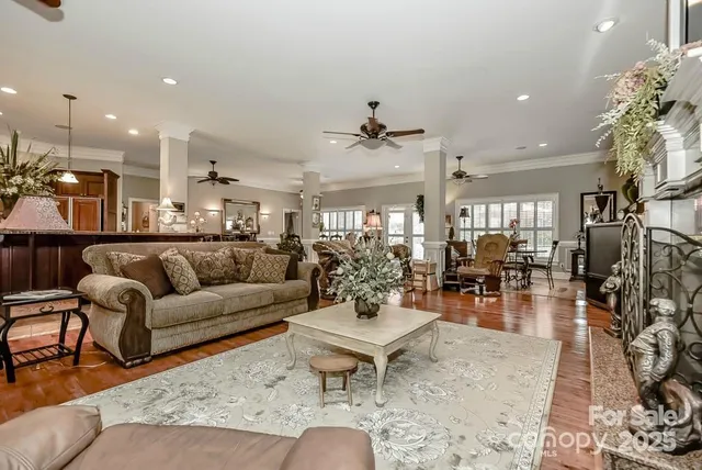 a living room with furniture kitchen view and a dining table