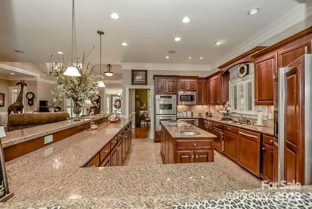 a view of a dining room with furniture and window