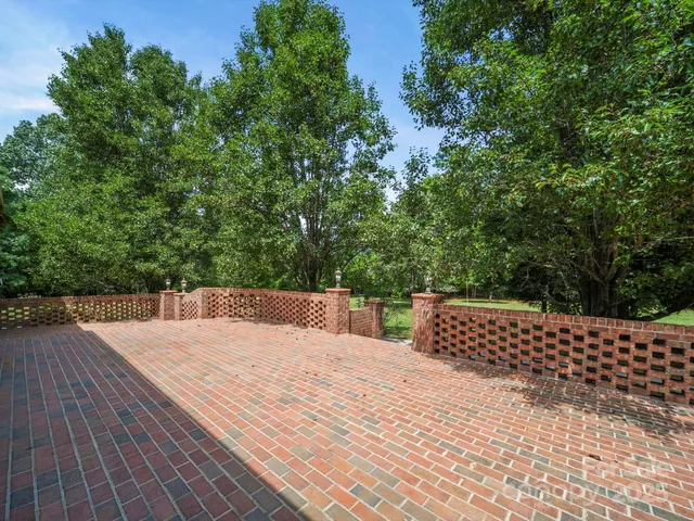a view of outdoor space with deck and trees