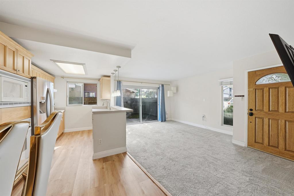961 Jamacha Road, Unit A El Cajon, CA 92019 - Photo 6 of 14 a view of a kitchen with furniture and wooden floor