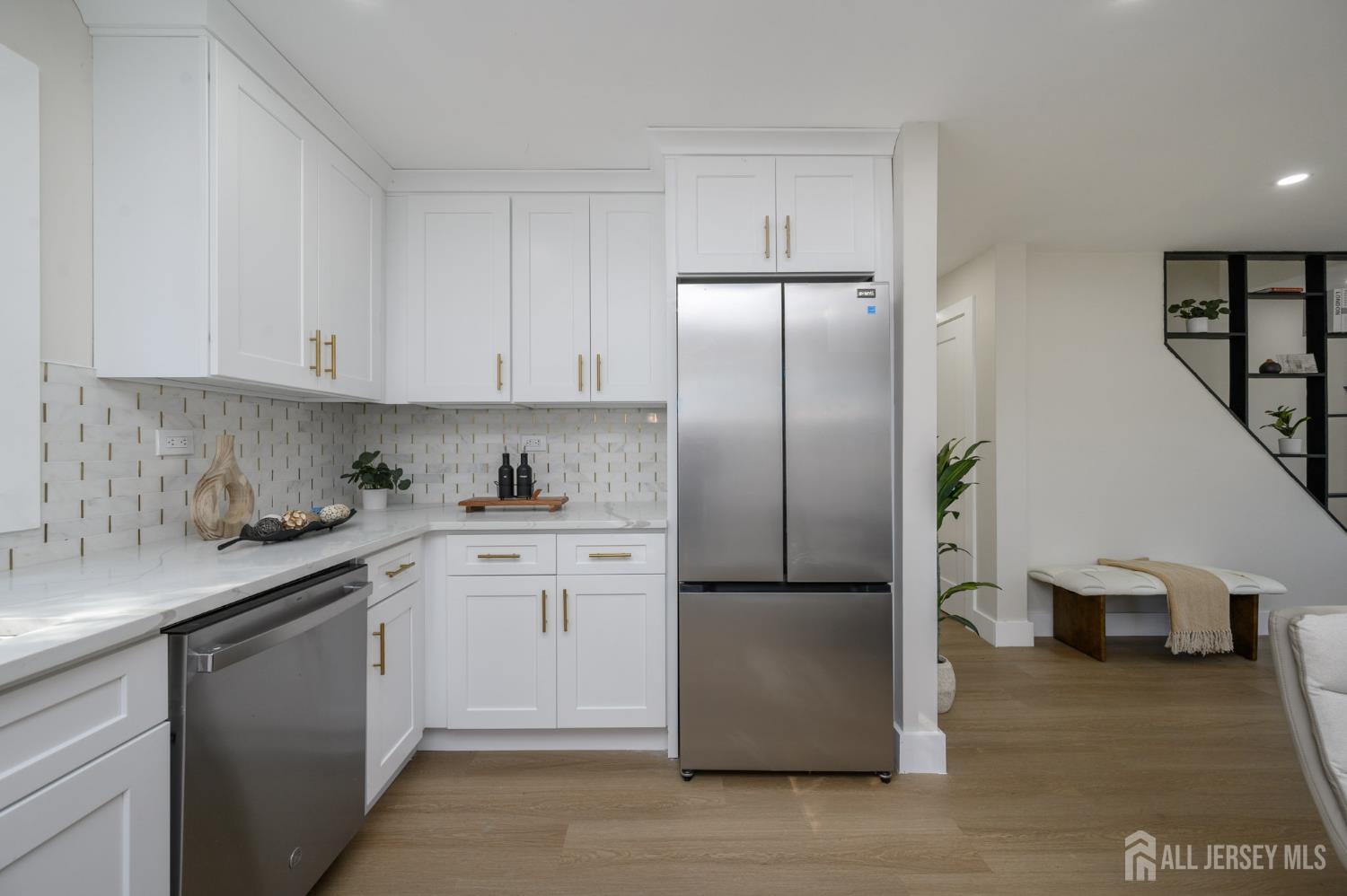 333 1st Street Middlesex, NJ 08846 - Photo 11 of 24 a kitchen with stainless steel appliances granite countertop a refrigerator a sink and white cabinets
