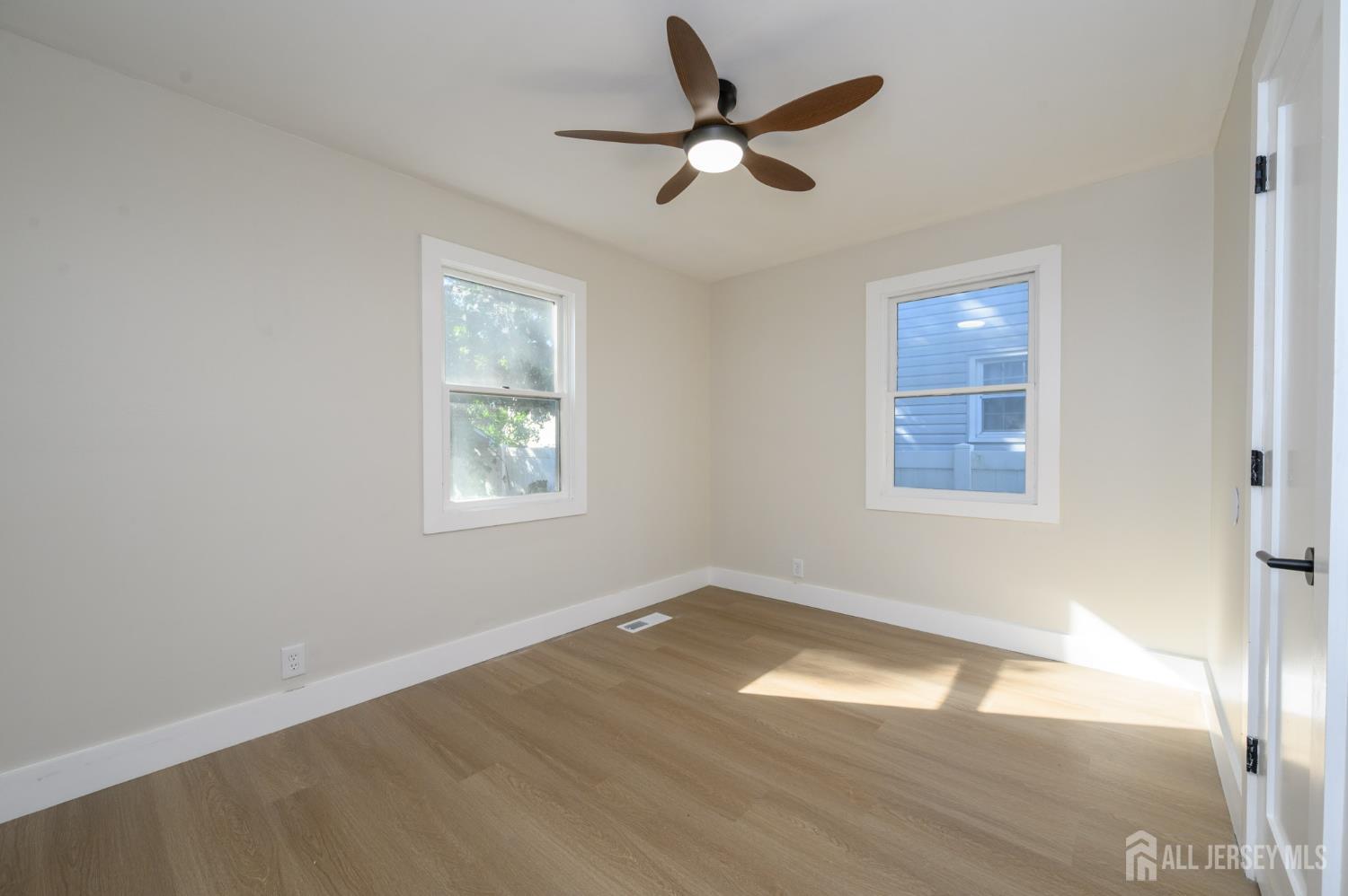 333 1st Street Middlesex, NJ 08846 - Photo 15 of 24 a view of a big room with wooden floor and windows
